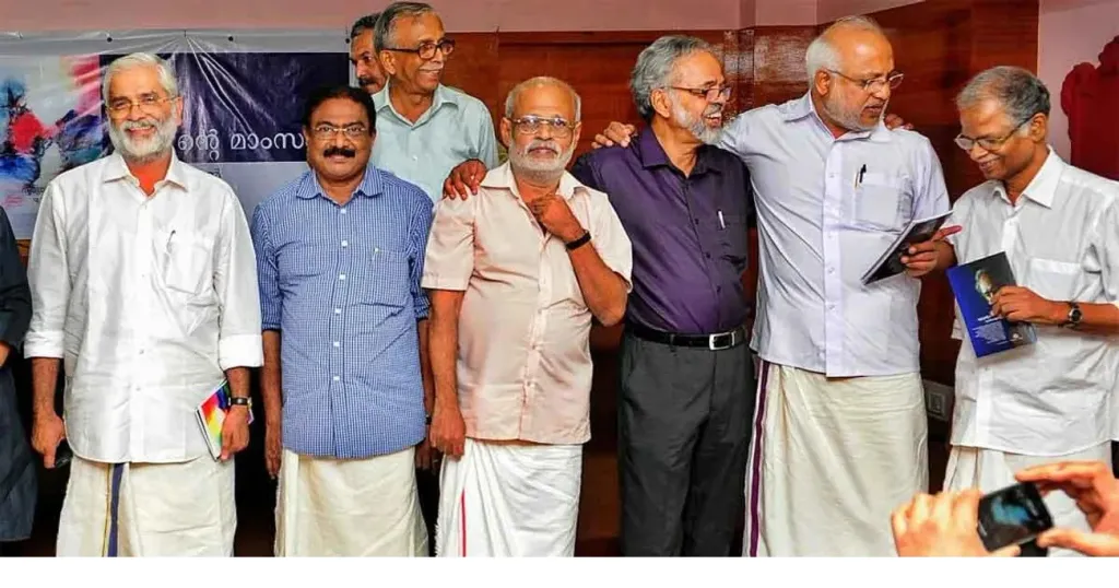 സുരേഷ് കുറുപ്പ്, എം.എസ്. കുമാർ, രാമചന്ദ്രൻ (പിന്നിൽ), സുധീഷ്, യു. ജയചന്ദ്രൻ, എം.എ. ബേബി, പി. രവികുമാർ എന്നിവർ 'സൂര്യന്റെ മാംസം' എന്ന പുസ്​തകത്തിന്റെ പ്രകാശനവേളയിൽ